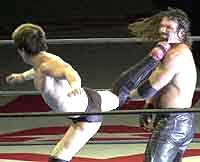 Koji uses his rolling savate on Frye from Nikkan Sports